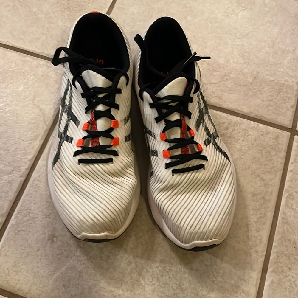 ASICS athletic shoes. In used condition